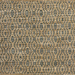 Handwoven wool rug with undulating oval stripe in shades of tan on a charcoal grey field. 