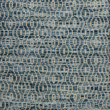 Handwoven wool rug with undulating oval stripe in shades of blue on a grey field. 