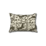 Rectangular throw pillow with a warm grey ram and botanical printed pattern on a cream linen background. 