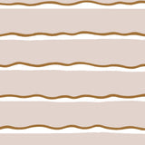 Detail of fabric in a wide undulating stripe pattern in brown and white on a light pink field.