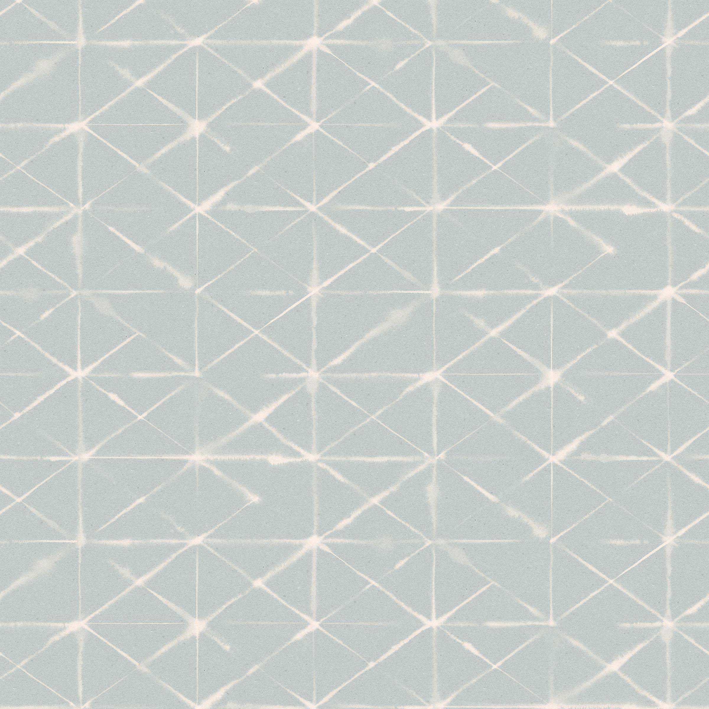 Detail of fabric in a mottled lattice print in white on a light blue field.