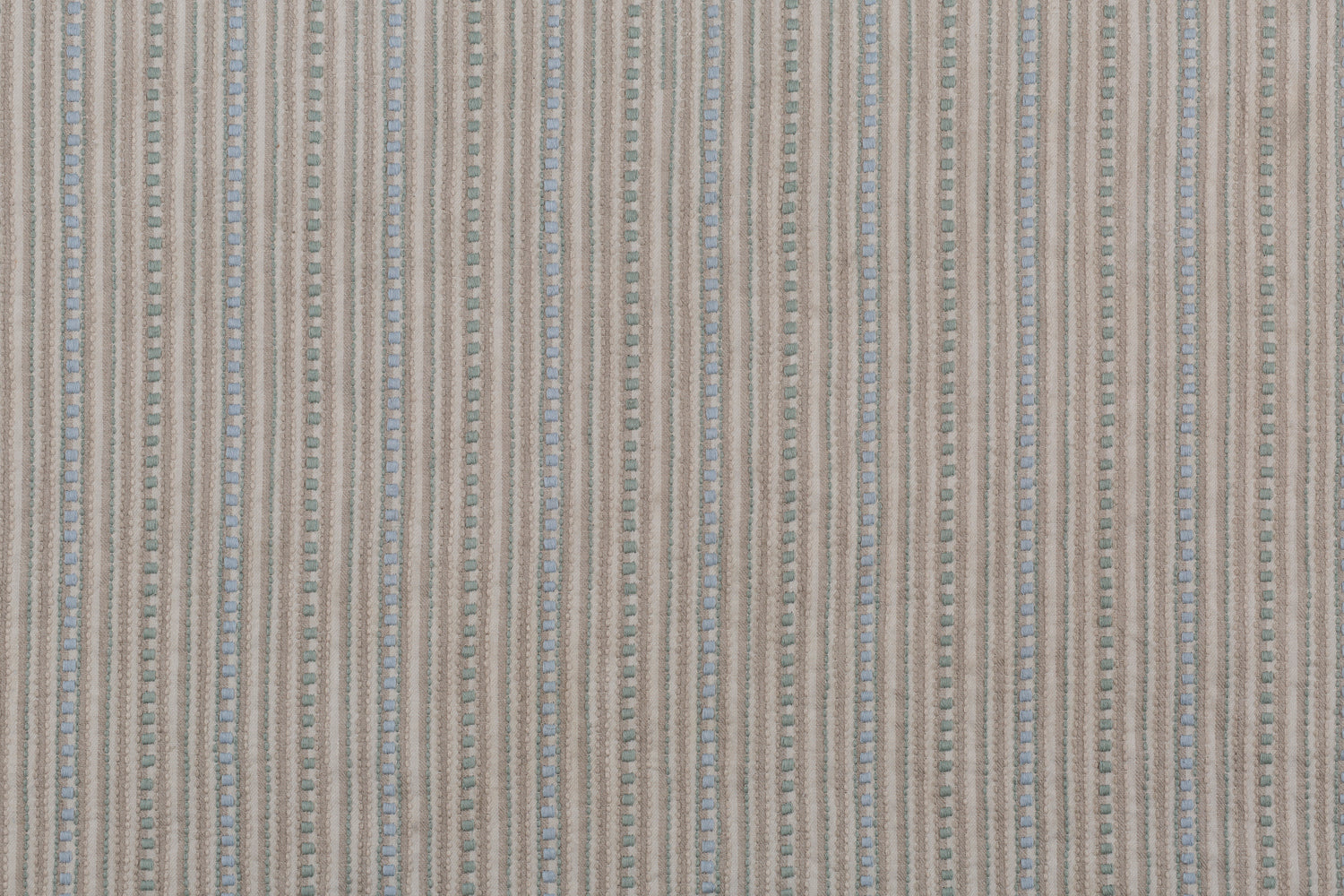 Dimensional embroidered fabric in an irregular stripe pattern in shades of taupe, cream, sage green and pale blue.