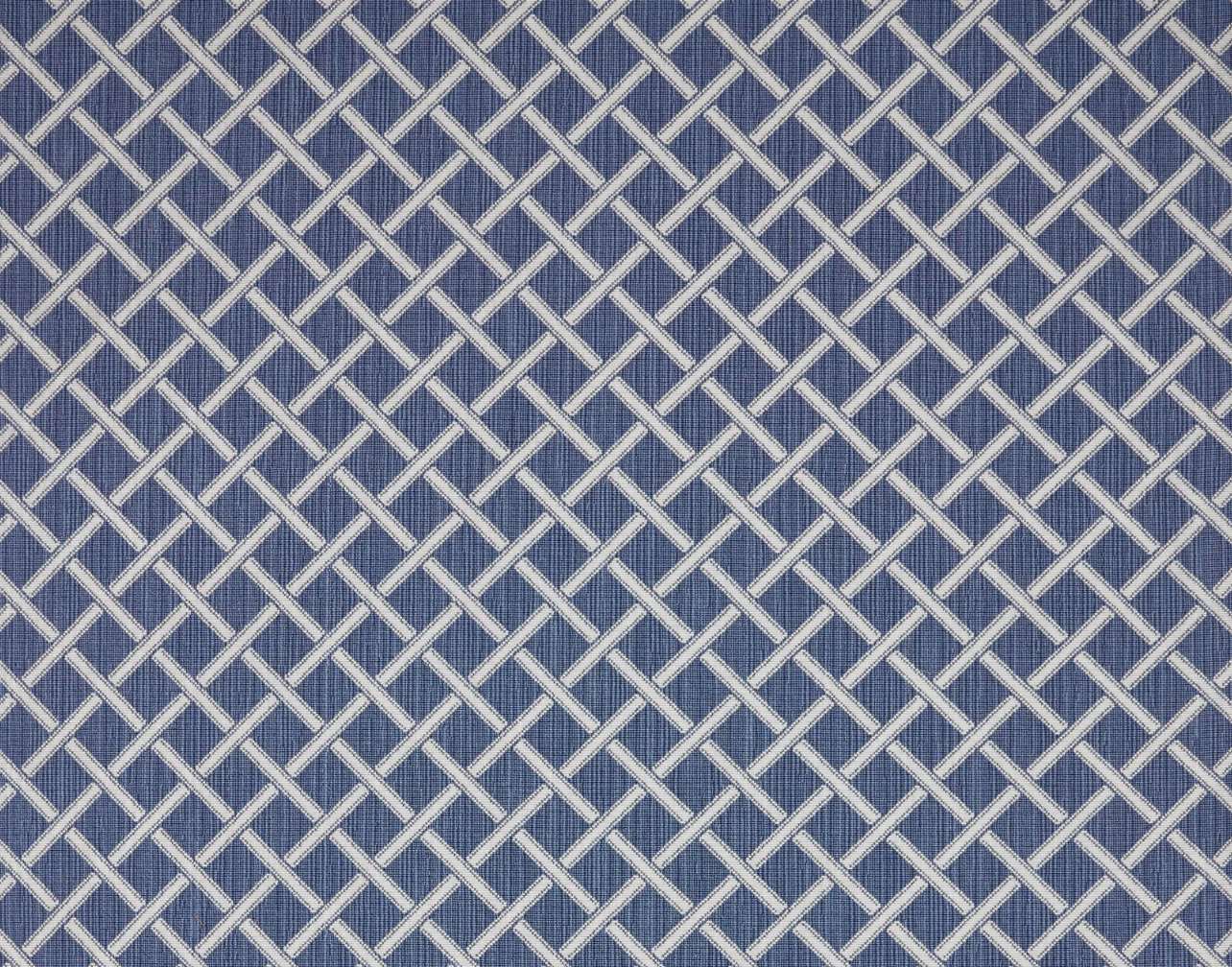 Broadloom carpet in a classic lattice in white on a cobalt blue field.