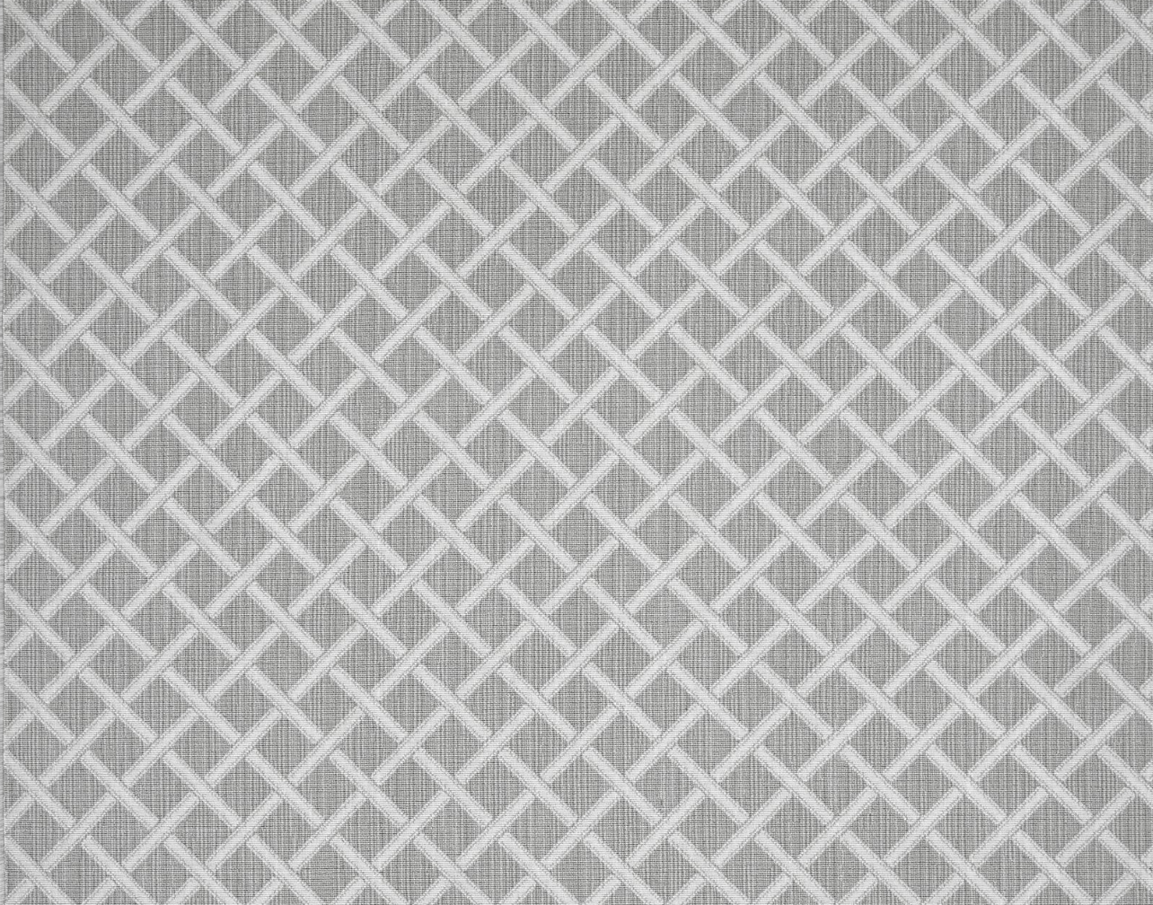 Broadloom carpet in a classic lattice in white on a grey field.