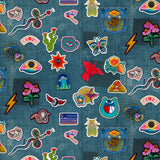 Collection of colorful embroidered patches on a denim fabric background