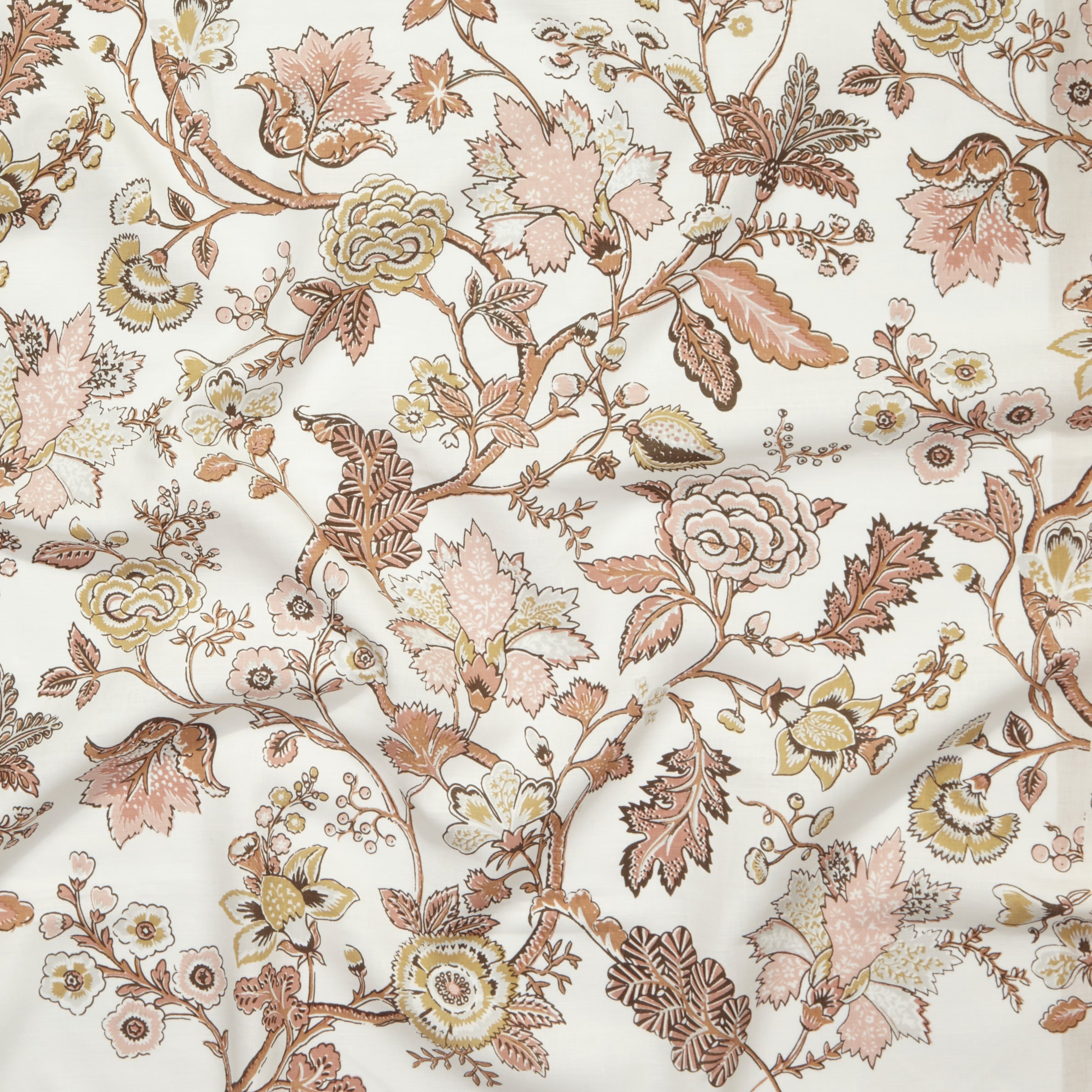 Close up of gently draped printed fabric in scrolling floral vine pattern in clay pink, grey tan and brown on white. 