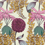 Detail of wallpaper in a dense floral print in shades of pink, green and yellow on a cream field.