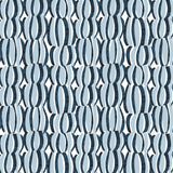 Detail of fabric in an abstract curvilinear print in blue and navy on a white field.