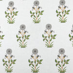 Detail of fabric in a large-scale marigold print in gray, orange and green on a cream field.
