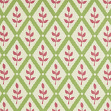 Detail of fabric in a lattice and leaf print in maroon and green on a white field.