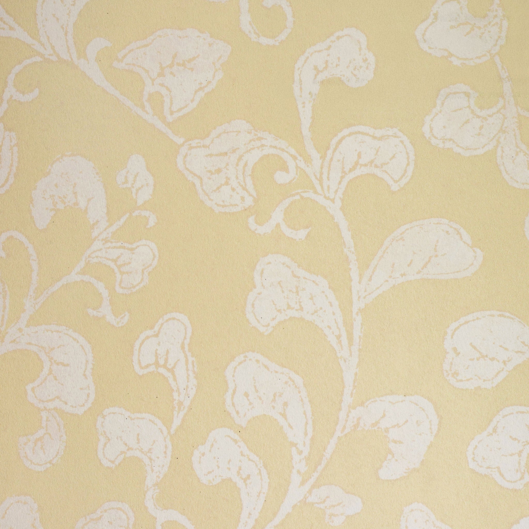 Cream leafy pattern on a yellow background