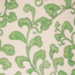 Green leafy pattern on a beige background
