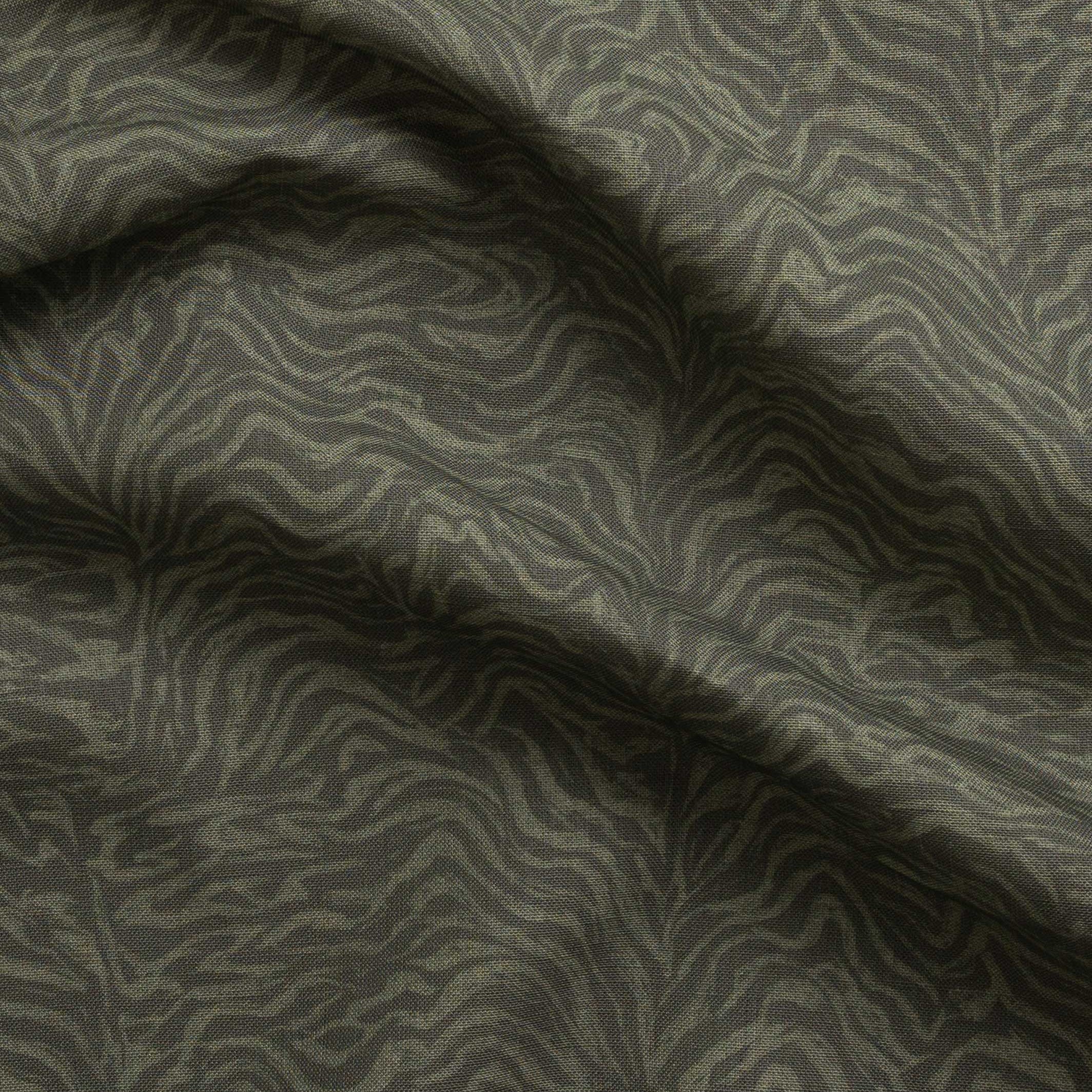 Detail of gently draped printed fabric with watercolor swirling stripe pattern in tonal olive green.