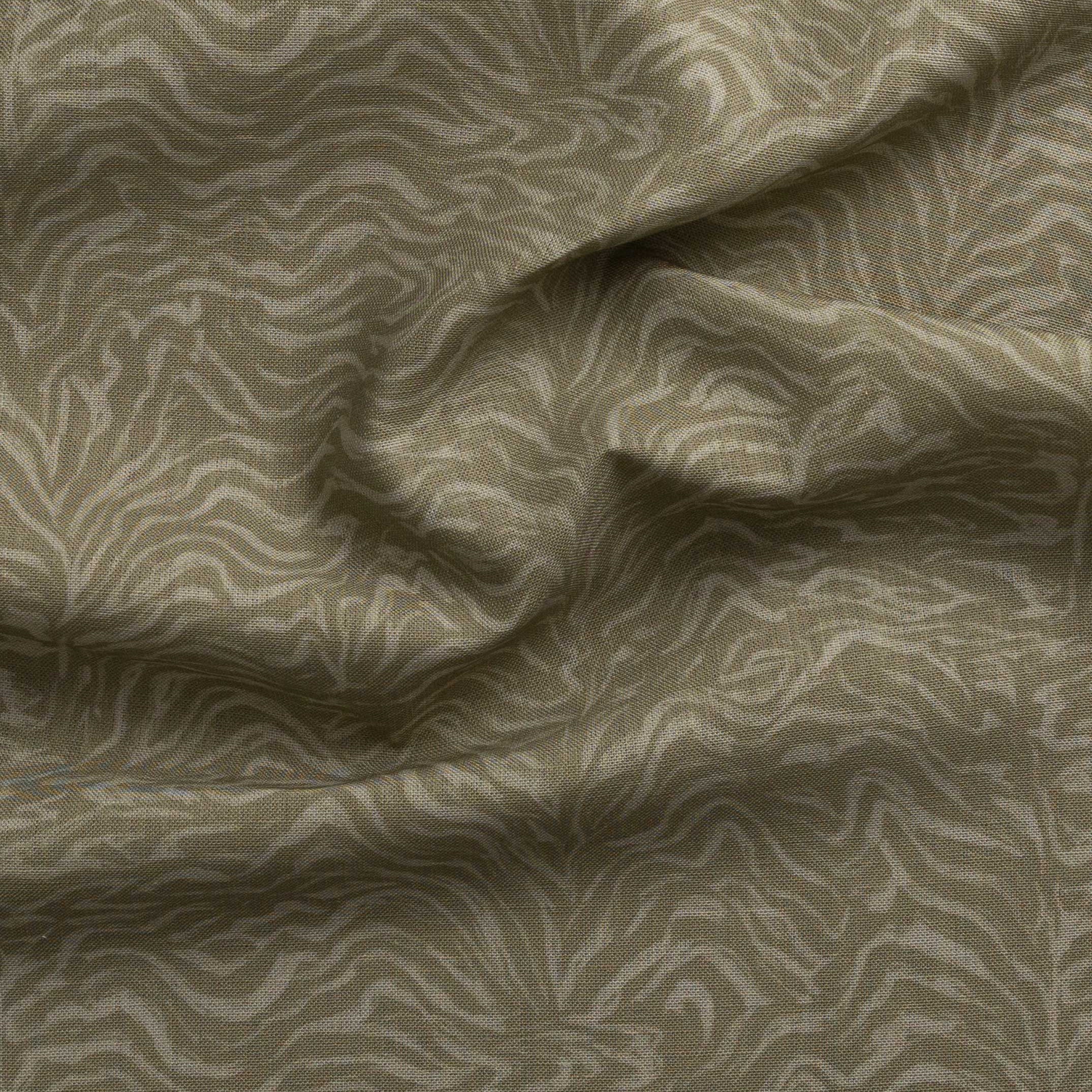 Detail of gently draped printed fabric with watercolor swirling stripe pattern in tonal muted sage green.