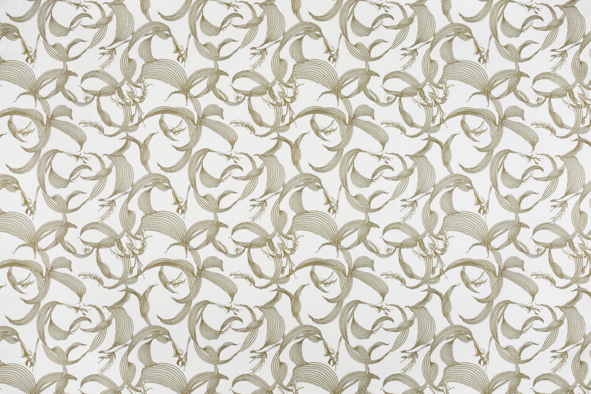 Detail of fabric in an abstract floral print in shades of tan on a cream field.