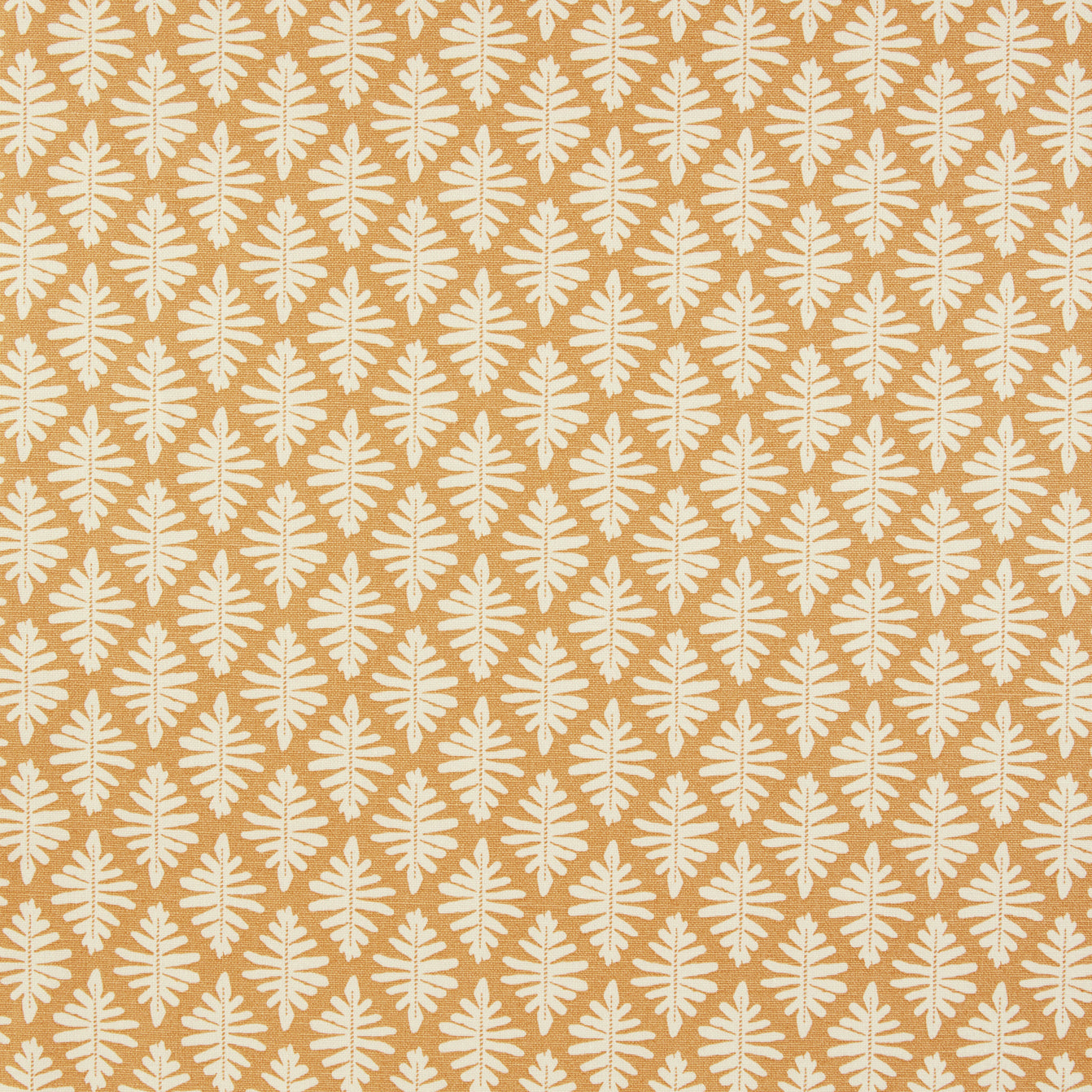 Detail of fabric in a repeating fern leaf print in white on a mustard field.