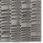 Detail of a hand-painted wallpaper swatch with an undulating ribbon pattern in charcoal.
