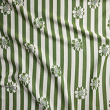 Fabric with green and white striped pattern and floral designs