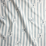 Fabric with blue and white stripes and floral patterns