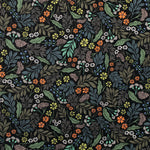 Detail of fabric in a small-scale floral print in shades of blue, green and orange on a black field.