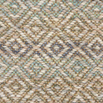 Handwoven rug detail in a diamond design in cream, yellow, blue