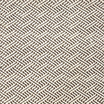 Indoor-Outdoor rug in a diamond basket weave in white and brown.