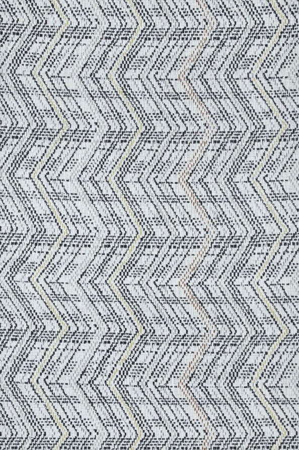 Broadloom carpet in a graphic herringbone stripe in black with pastel accents on a white field. 