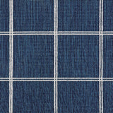 Broadloom carpet sample with windowpane grid in cream on a navy blue background. 