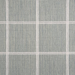 Broadloom carpet sample with windowpane grid in cream on a sky blue background. 