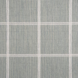 Broadloom carpet sample with windowpane grid in cream on a sky blue background. 
