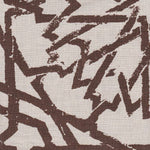 Detail of fabric in a textural lattice print in brown on a cream field.