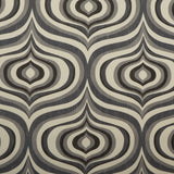 Detail of fabric in a curvilinear geometric print in shades of gray and charcoal on a cream field.