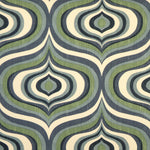 Detail of fabric in a curvilinear geometric print in shades of blue, green and navy on a cream field.