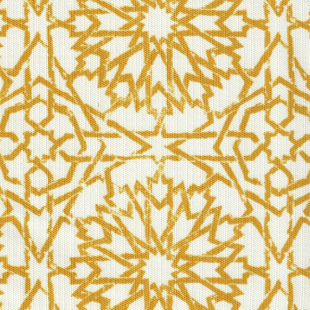 Detail of fabric in a small-scale lattice print in mustard on a white field.