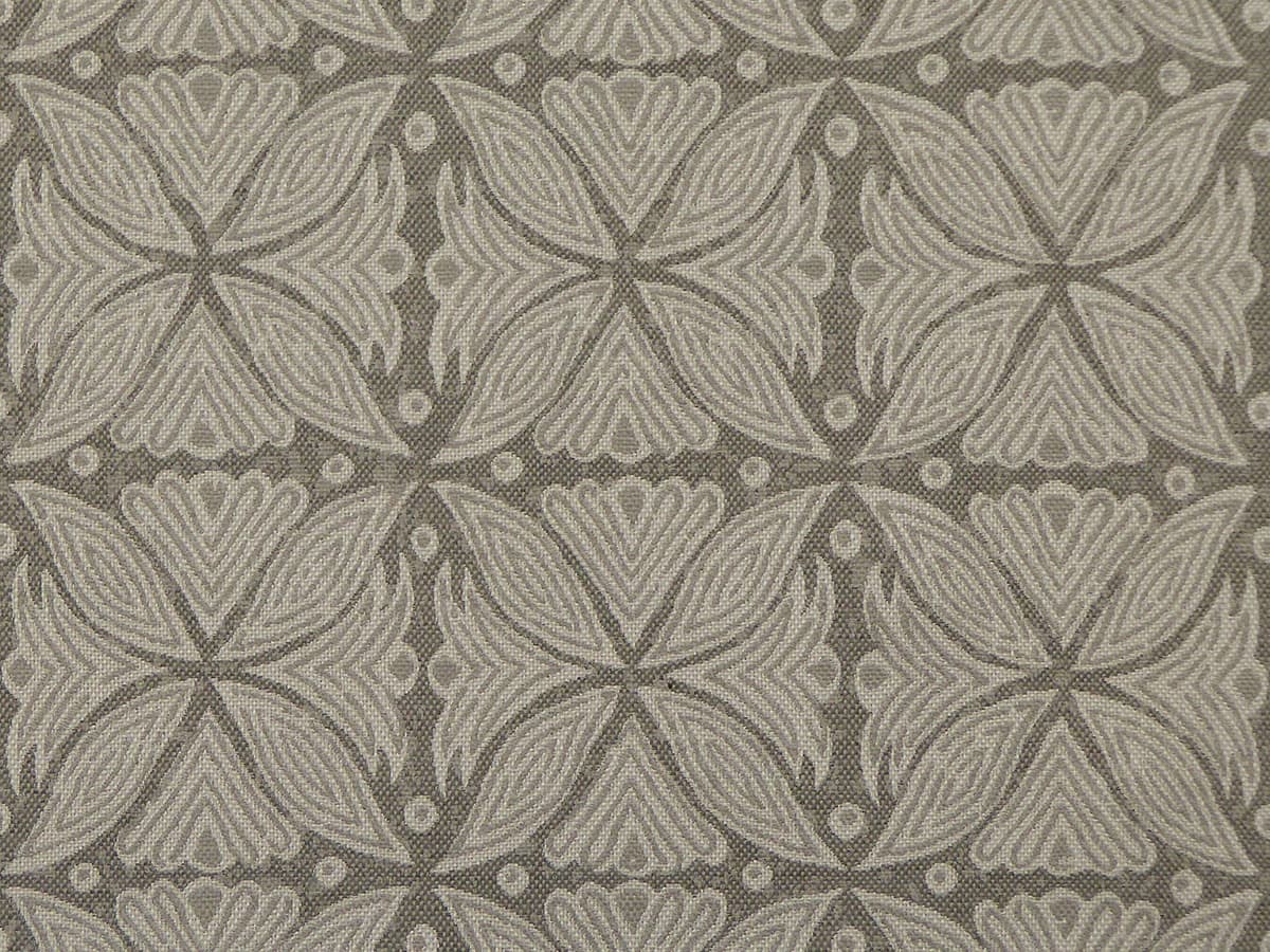 Detail of fabric in a botanical geometric print in shades of gray.