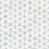 Detail of wallpaper in a painterly lattice print in light blue on a cream field.