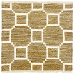 Woven rug swatch with a ivory lattice pattern on a taupe field with ivory fringe edges at top and bottom