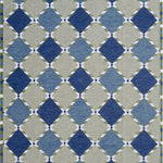 Handwoven rug in a Swedish diamond lattice design shades of green and blue with white accents. 
