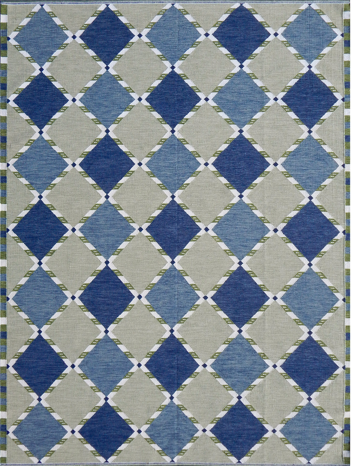 Handwoven rug in a Swedish diamond lattice design shades of green and blue with white accents. 