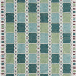 Handwoven rug in a Swedish checkerboard design shades of green and teal with white and brown accents. 