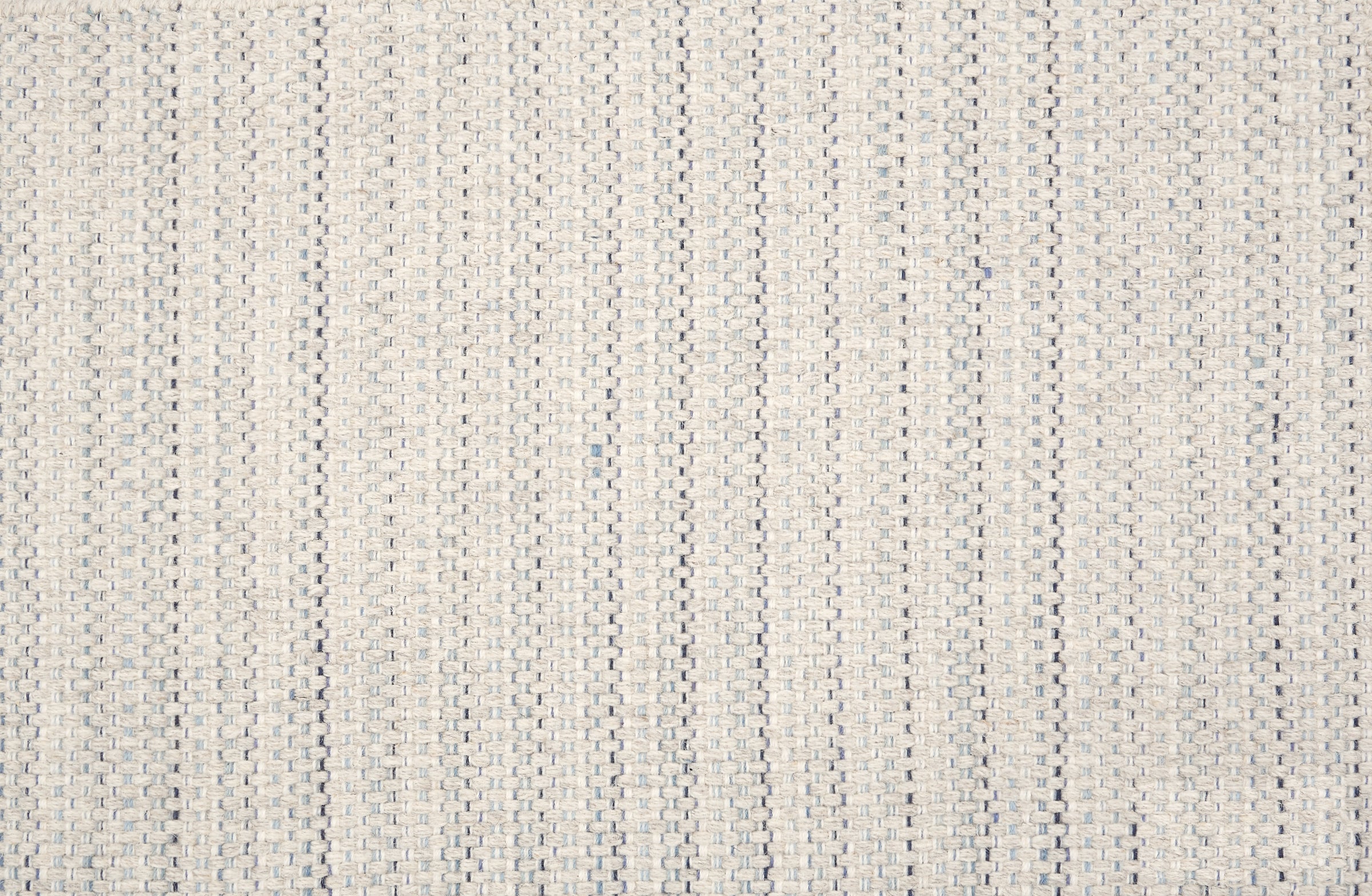 Broadloom carpet in a striated stripe in cream with blue accents. 