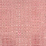 Patterned fabric swatch with a geometric design on a red background