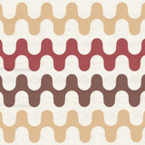 Detail of wallpaper in a playful curving stripe print in shades of yellow, red and orange on a white field.