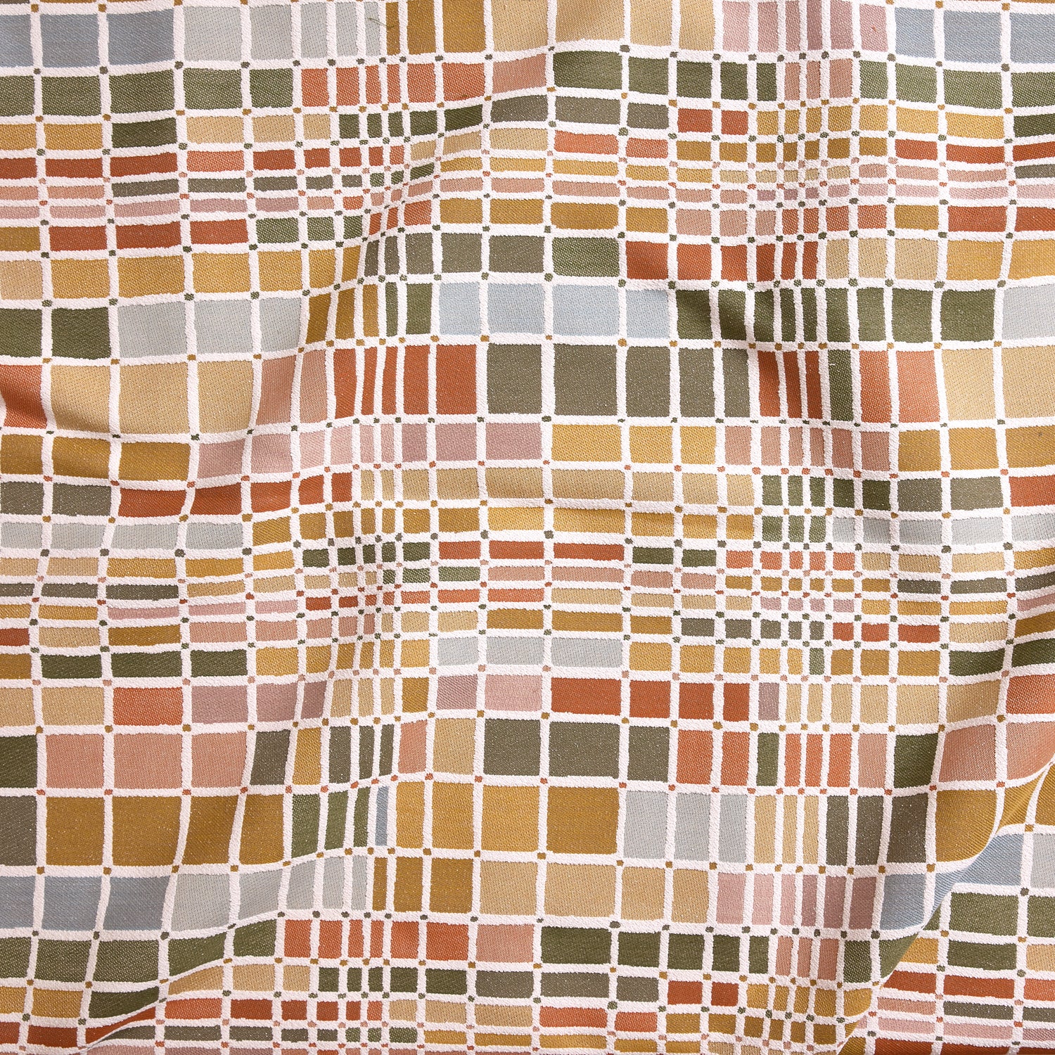 Close up of gently draped woven Indoor-Outdoor fabric with complex windowpane pattern in white with squares of green, orange, yellow, pink and light blue. 