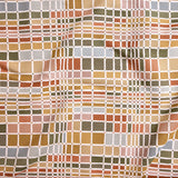 Close up of gently draped woven Indoor-Outdoor fabric with complex windowpane pattern in white with squares of green, orange, yellow, pink and light blue. 