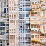 Gently draped fabric cuttings with complex window pane plaid in various colors. 