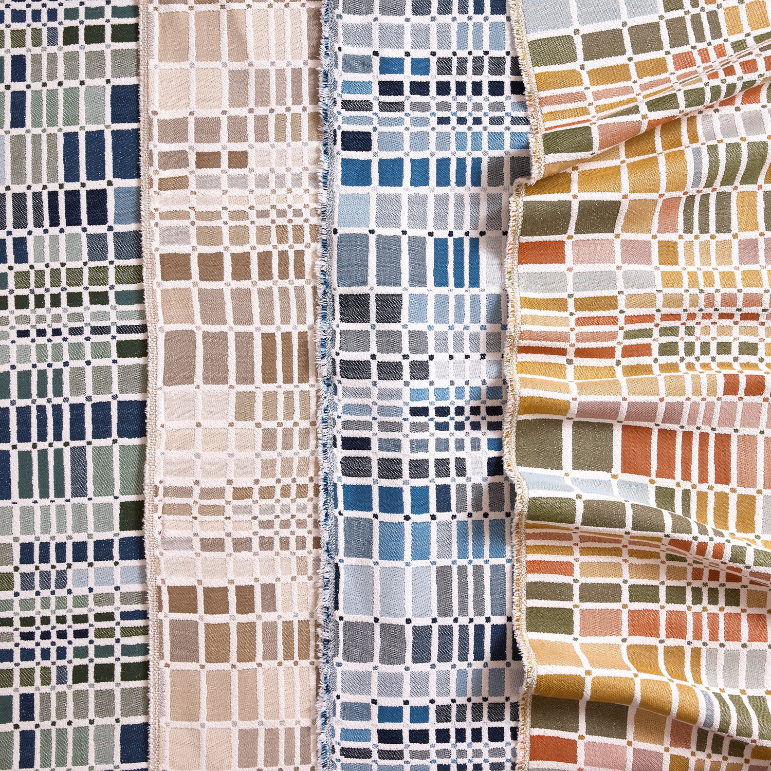 Gently draped fabric cuttings with complex window pane plaid in various colors. 
