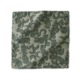 Woven fabric painterly botanical lace pattern in green. 