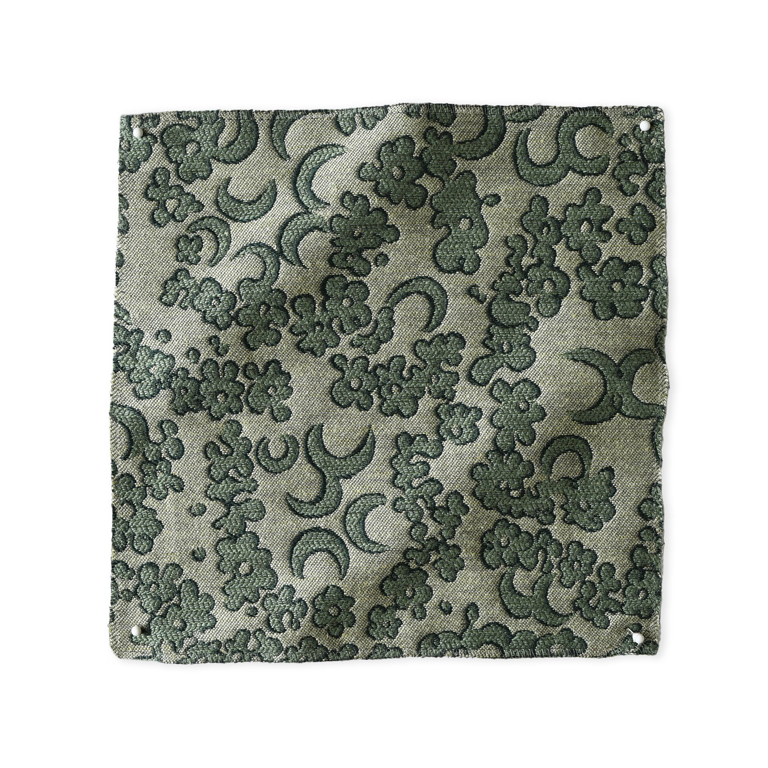 Woven fabric painterly botanical lace pattern in green. 