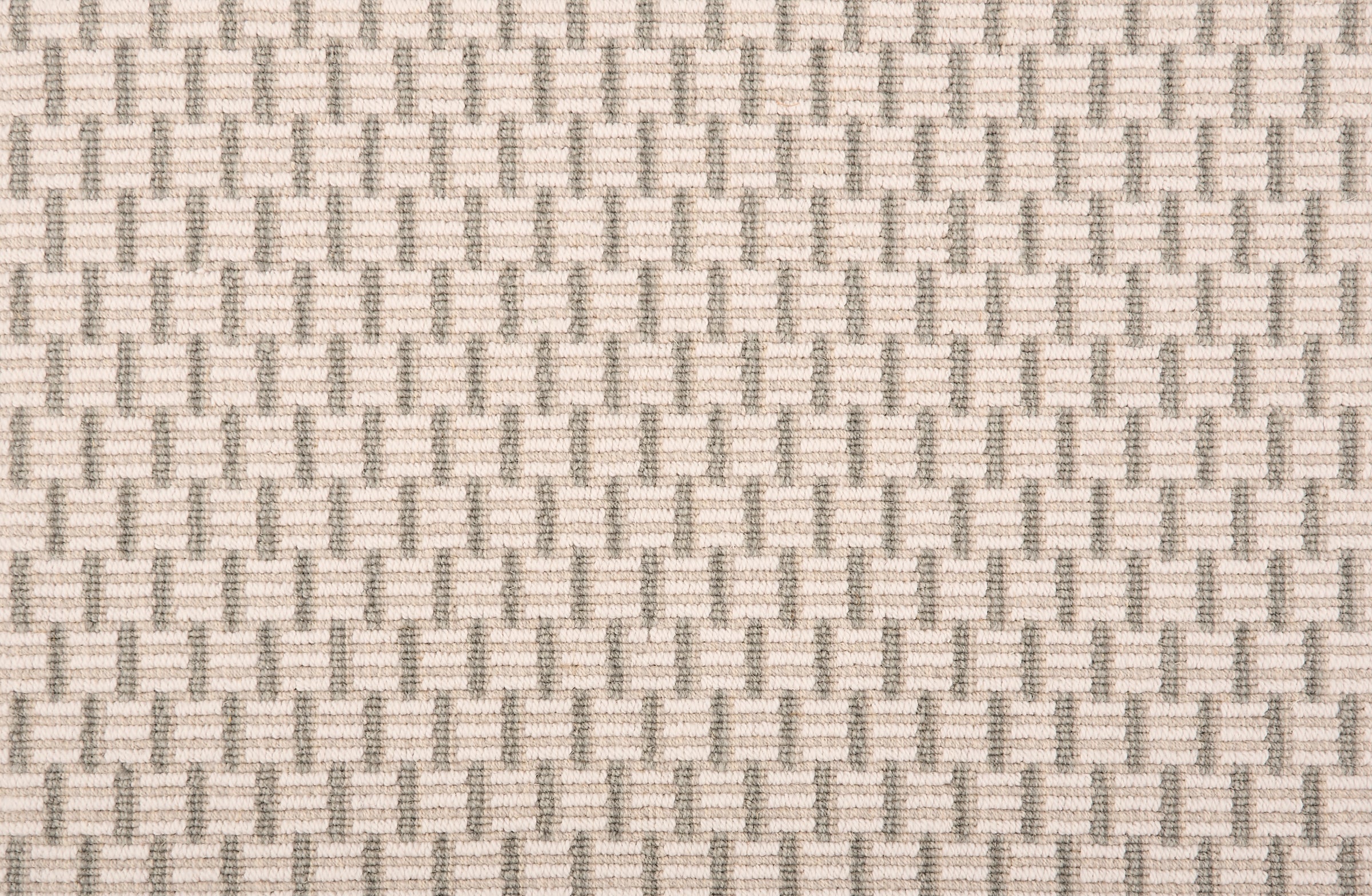Broadloom carpet in a small striped check in taupe.